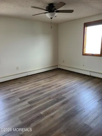 a living room with a couch and a mirror