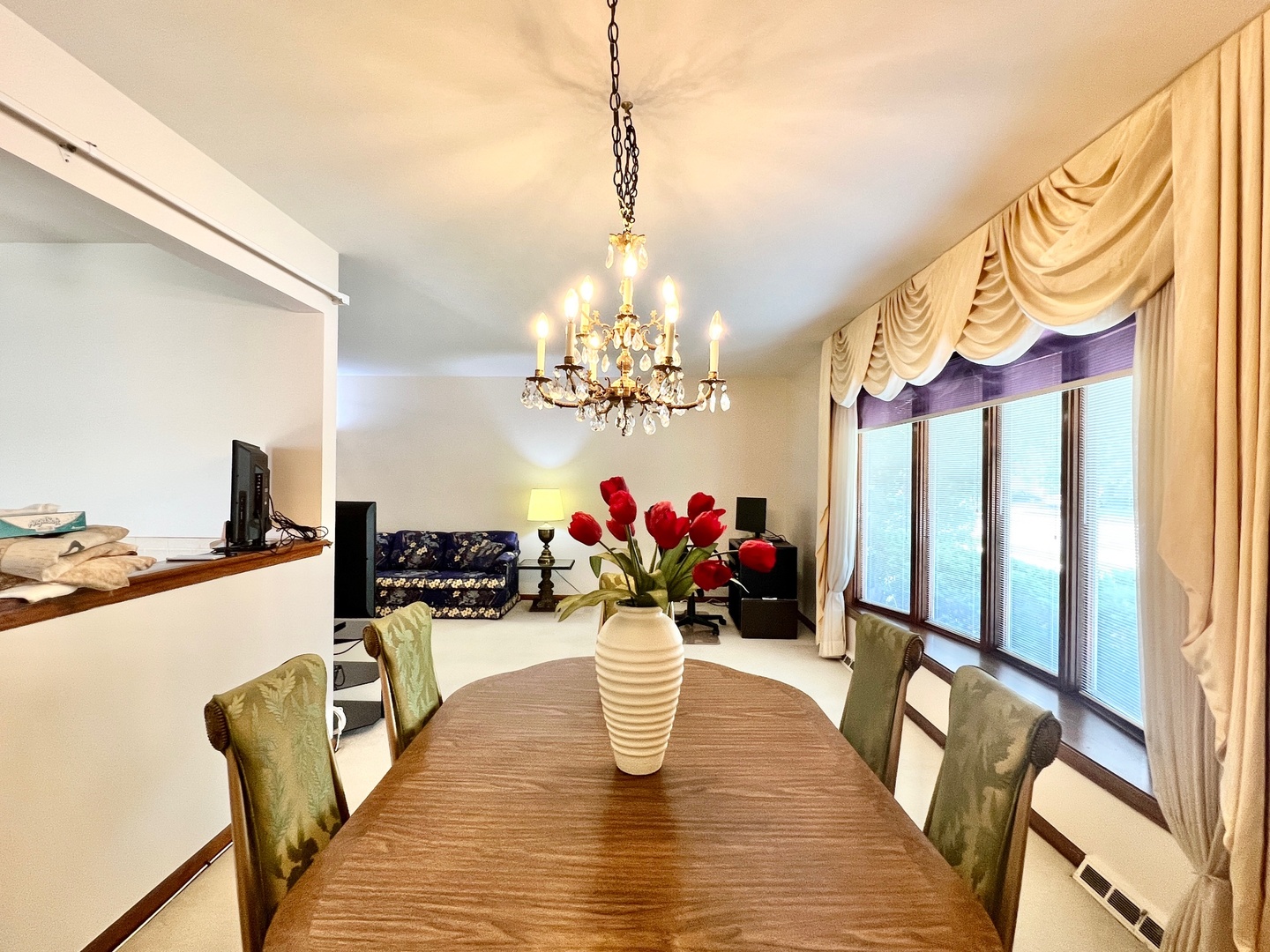 837 North Dee Road Park Ridge, IL 60068 - Photo 6 of 29 a dining room with furniture a chandelier and wooden floor