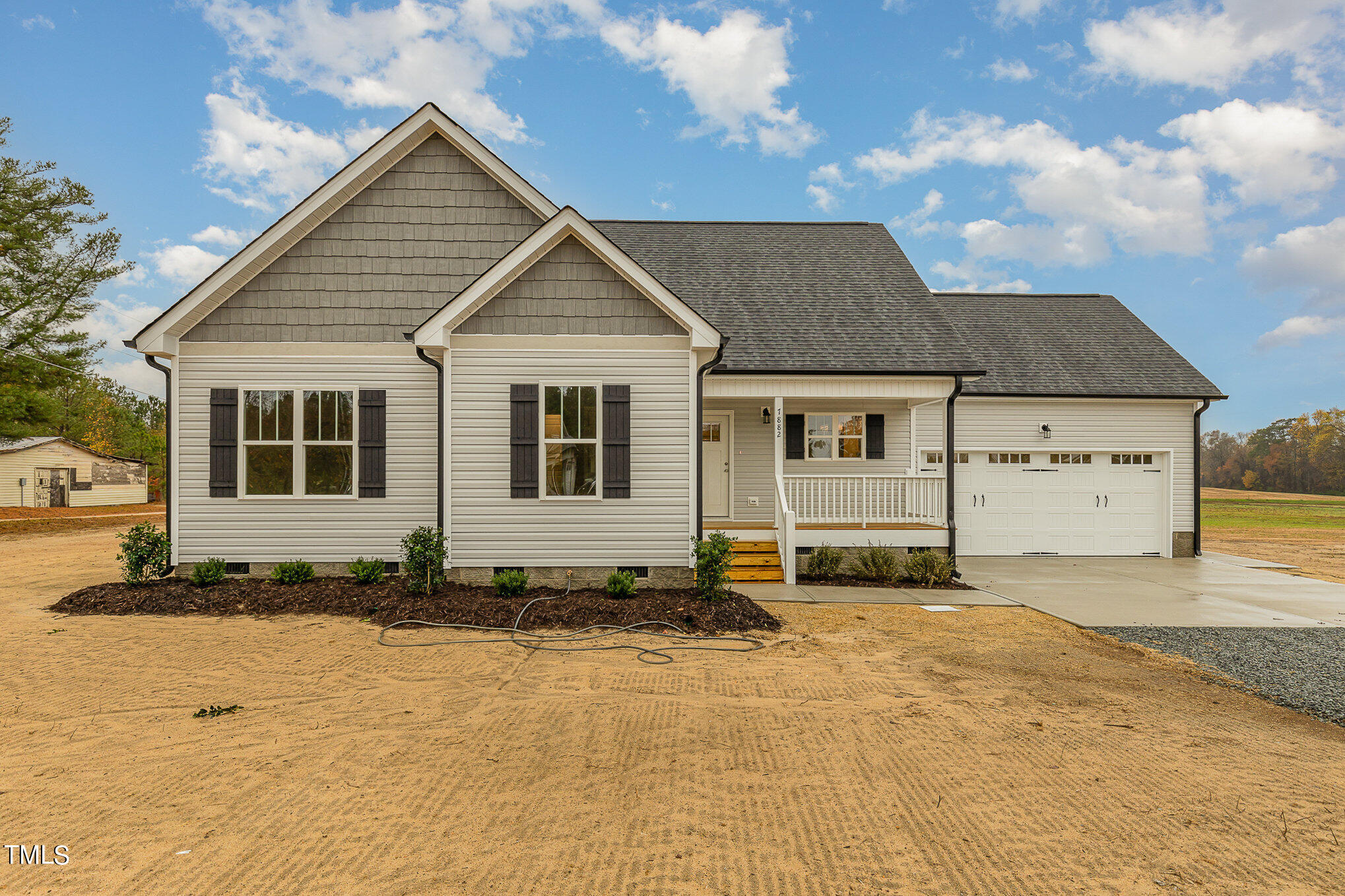 7882 Highway 27 Coats, NC 27521 - Photo 2 of 13 a front view of a house with a yard