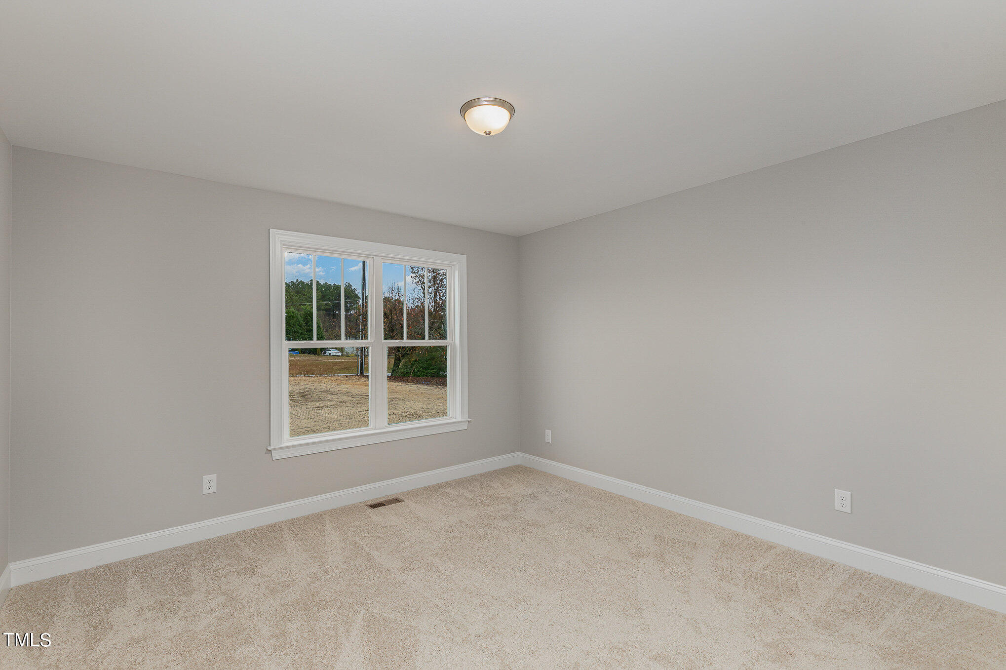 7882 Highway 27 Coats, NC 27521 - Photo 5 of 13 an empty room with a window
