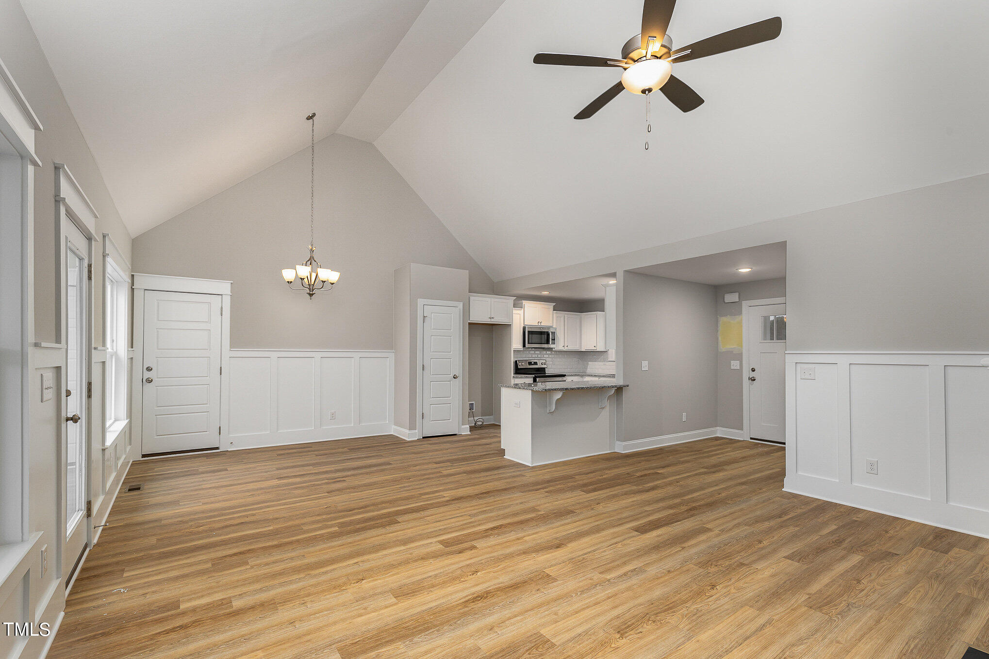 7882 Highway 27 Coats, NC 27521 - Photo 8 of 13 a view of a kitchen with wooden floor a sink a refrigerator and window