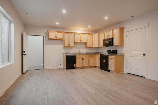 4595 North Fallow Way, Unit 511 Eagle Mountain, UT 84005 - Photo 4 of 32 Kitchen featuring light wood finish cabinets, black appliances, light wood-type flooring, and recessed lighting