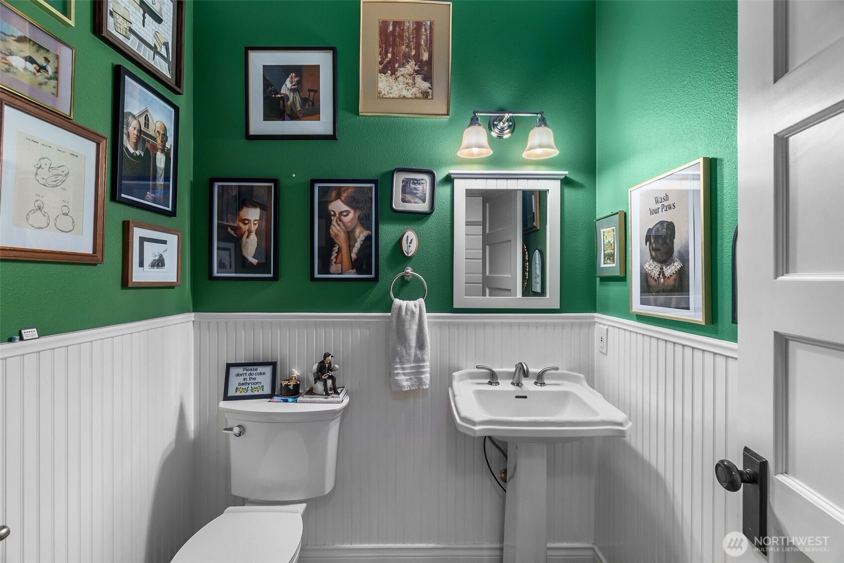 1130 East Sunset Hill Road Shelton, WA 98584 - Photo 20 of 40 a bathroom with a sink and mirror with toilet