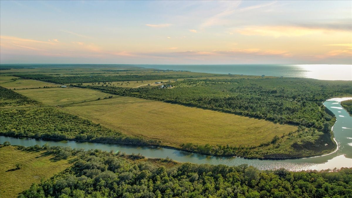 Tbd Gau Road Anahuac, TX 77514 - Photo 7 of 28 a view of a lake with a yard