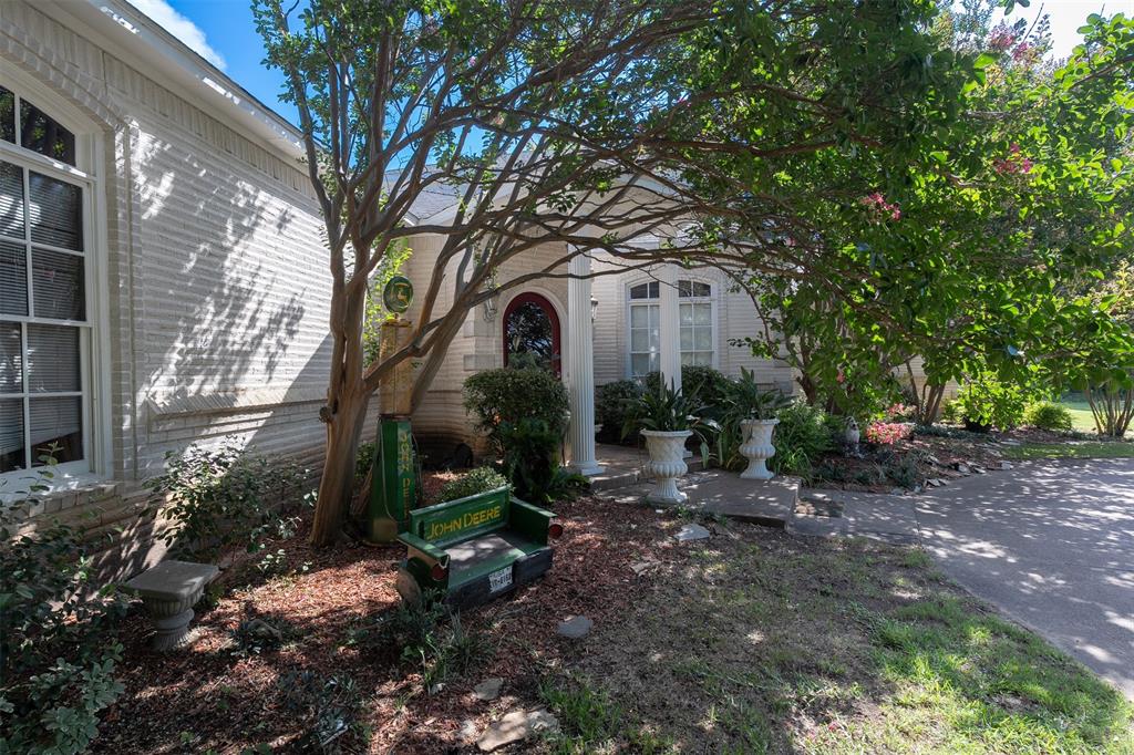 6529 Asher Road Alvarado, TX 76009 - Photo 17 of 39 a front view of a house with garden