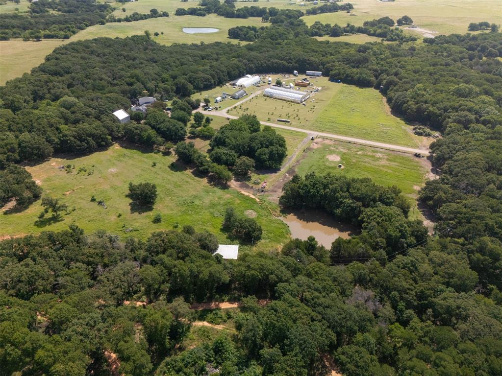 6529 Asher Road Alvarado, TX 76009 - Photo 2 of 39 an aerial view of residential house with outdoor space and trees all around