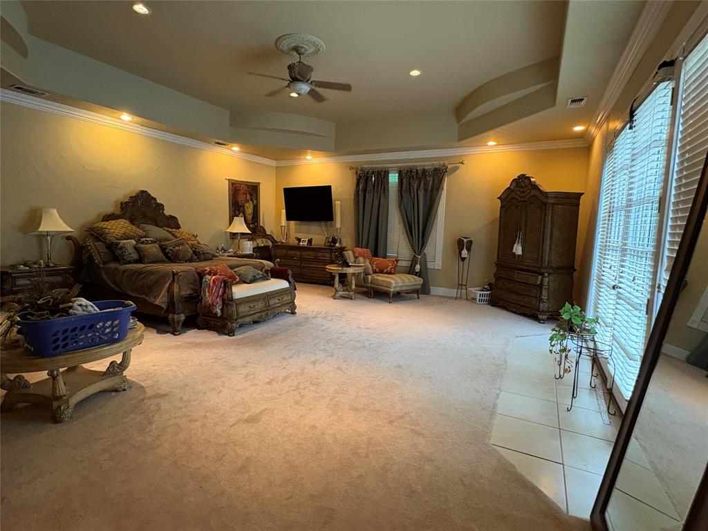 6529 Asher Road Alvarado, TX 76009 - Photo 24 of 39 a living room with furniture gym equipment and a flat screen tv