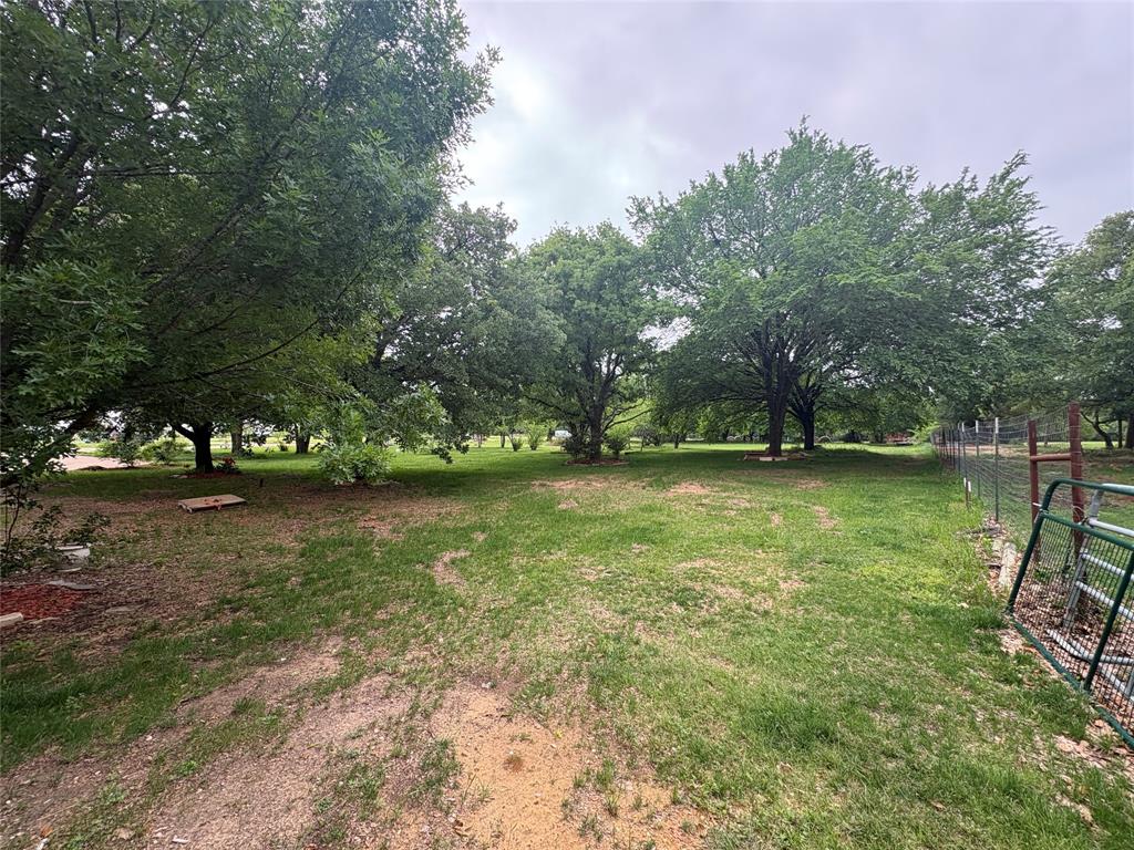 6529 Asher Road Alvarado, TX 76009 - Photo 27 of 39 a view of a bench in a yard