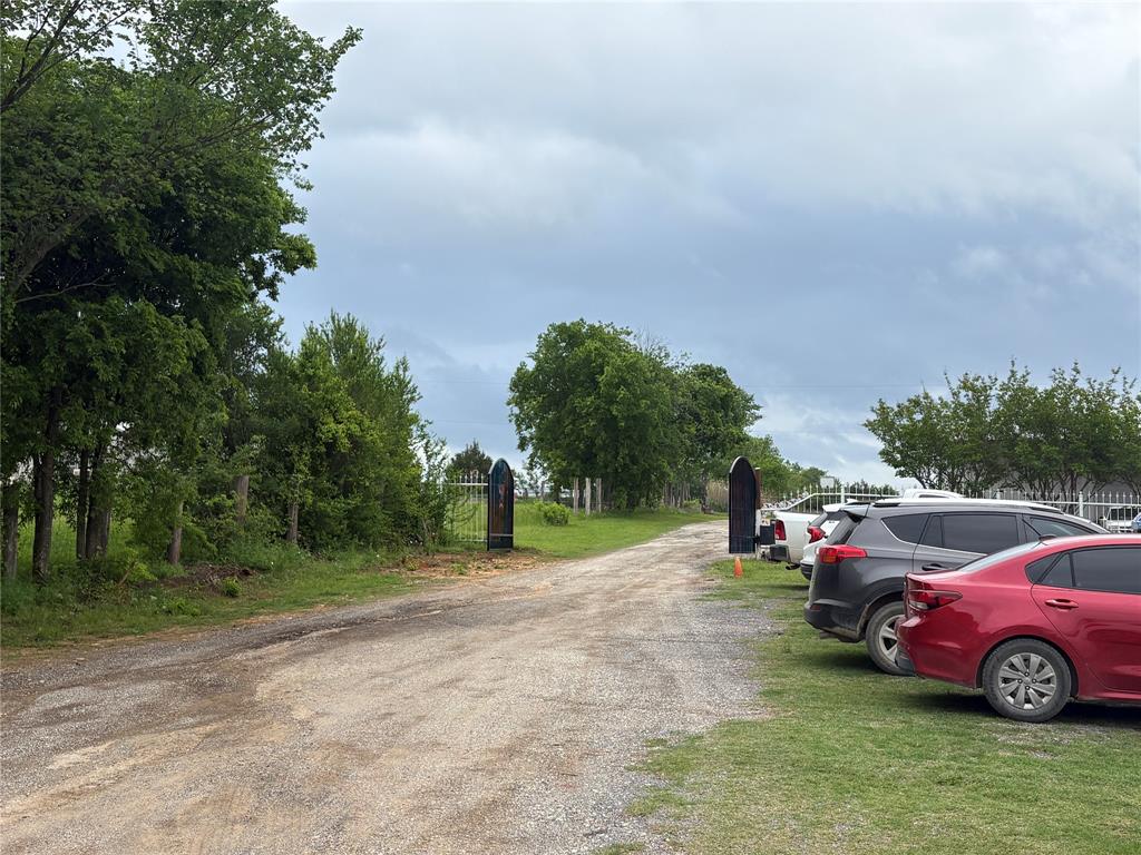 6529 Asher Road Alvarado, TX 76009 - Photo 30 of 39 a view of a yard with car parked