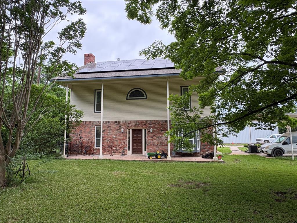 6529 Asher Road Alvarado, TX 76009 - Photo 7 of 39 a front view of a house with a garden