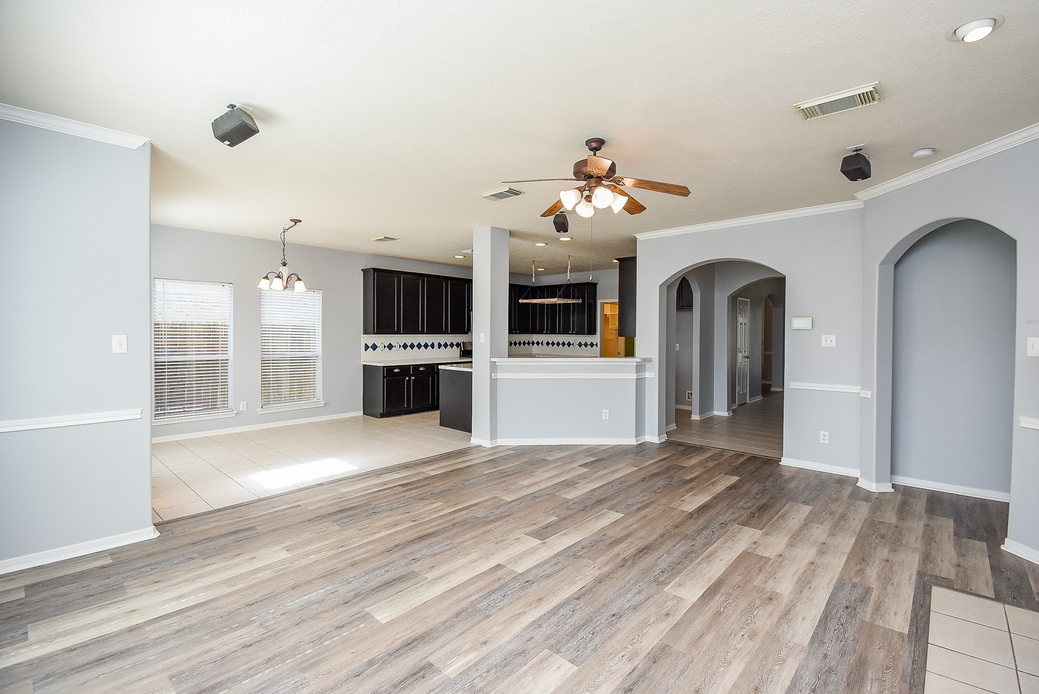 3918 Austin Lake Court Pearland, TX 77581 - Photo 11 of 32 a view of a livingroom with a fireplace wooden floor and windows