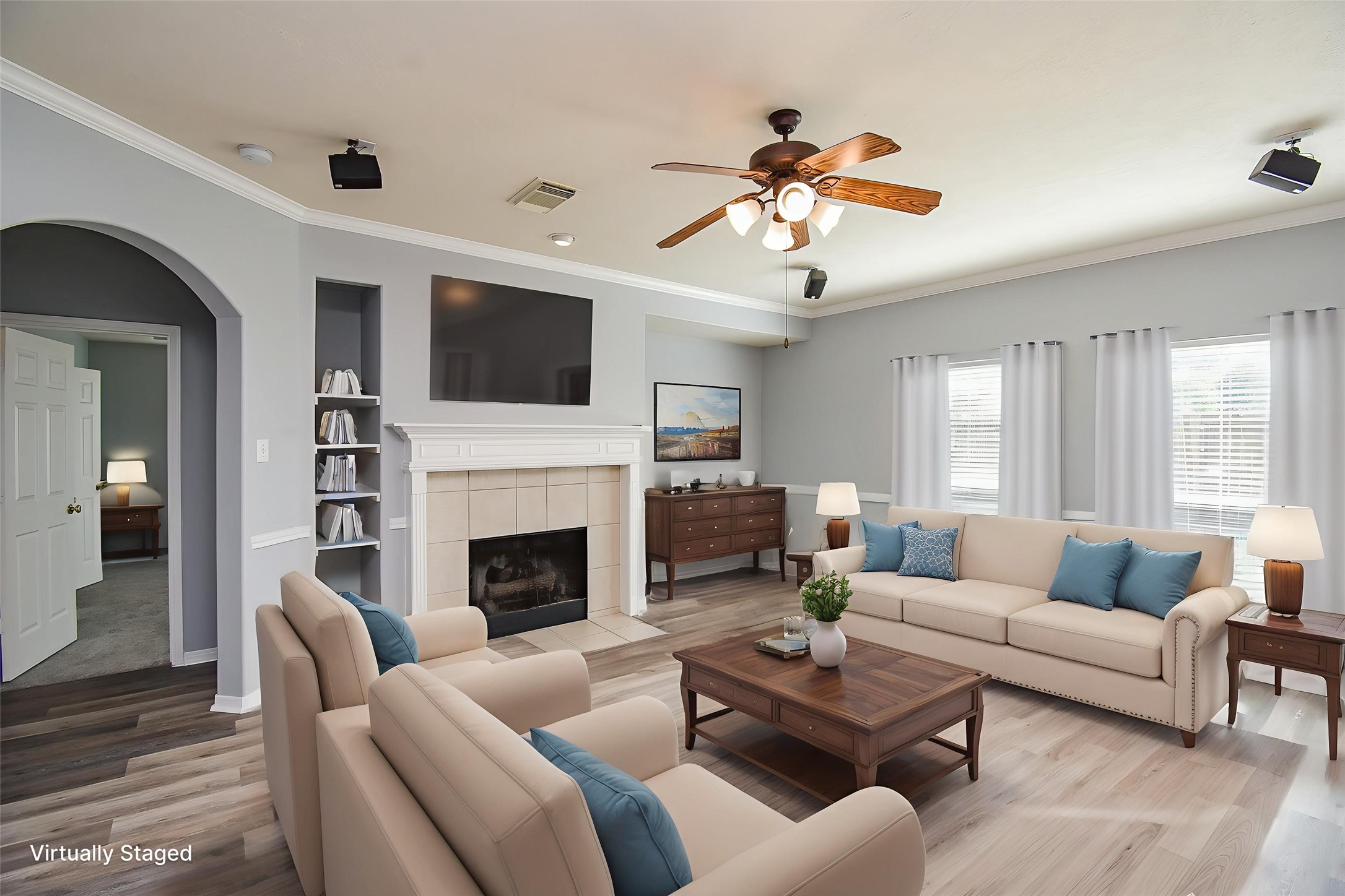 3918 Austin Lake Court Pearland, TX 77581 - Photo 12 of 32 a living room with furniture a fireplace and a flat screen tv