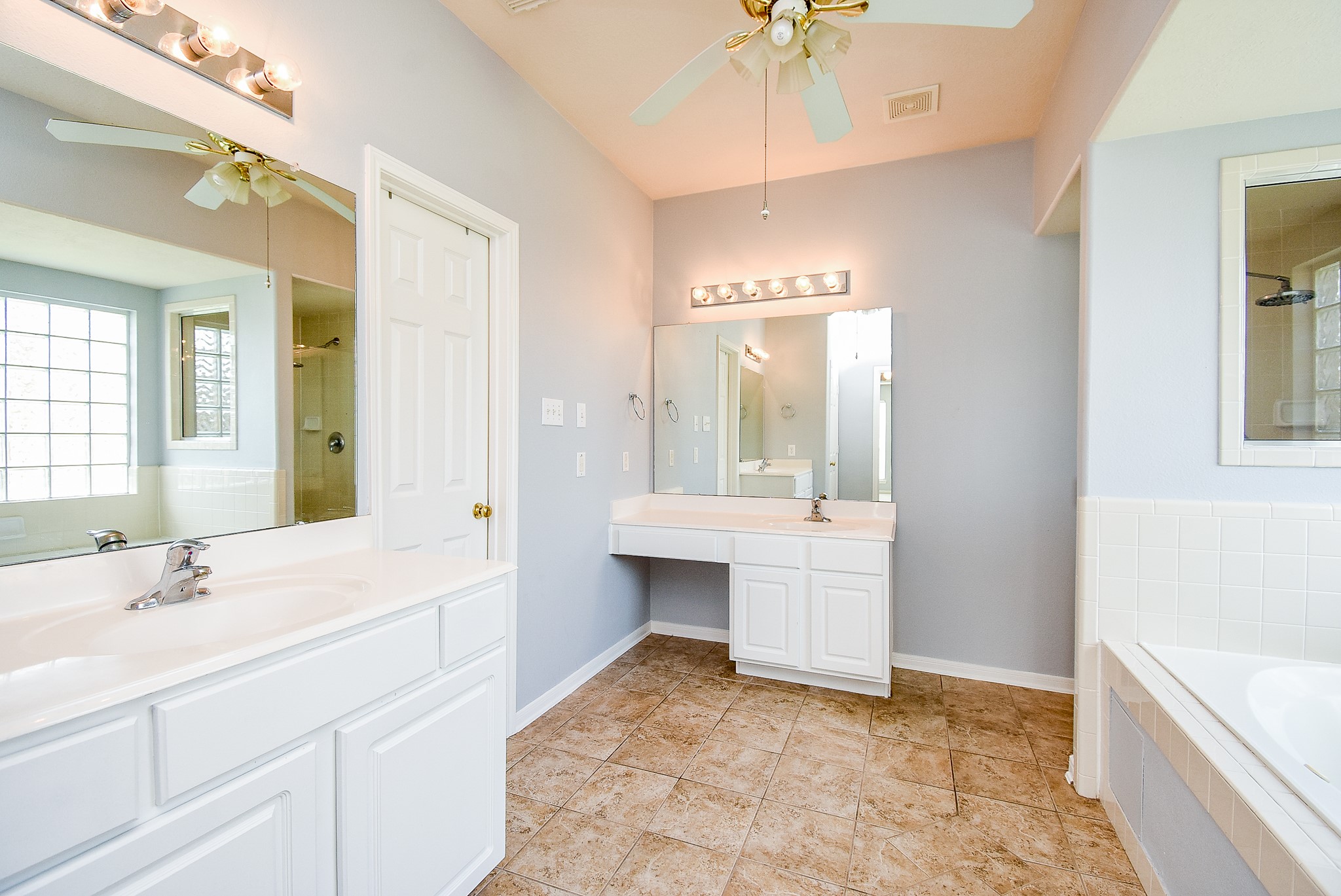 3918 Austin Lake Court Pearland, TX 77581 - Photo 16 of 32 a bathroom with a sink and a mirror