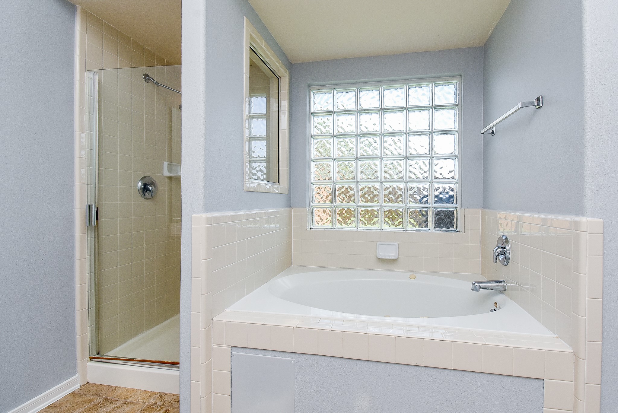 3918 Austin Lake Court Pearland, TX 77581 - Photo 18 of 32 a white bath tub sitting next to a window