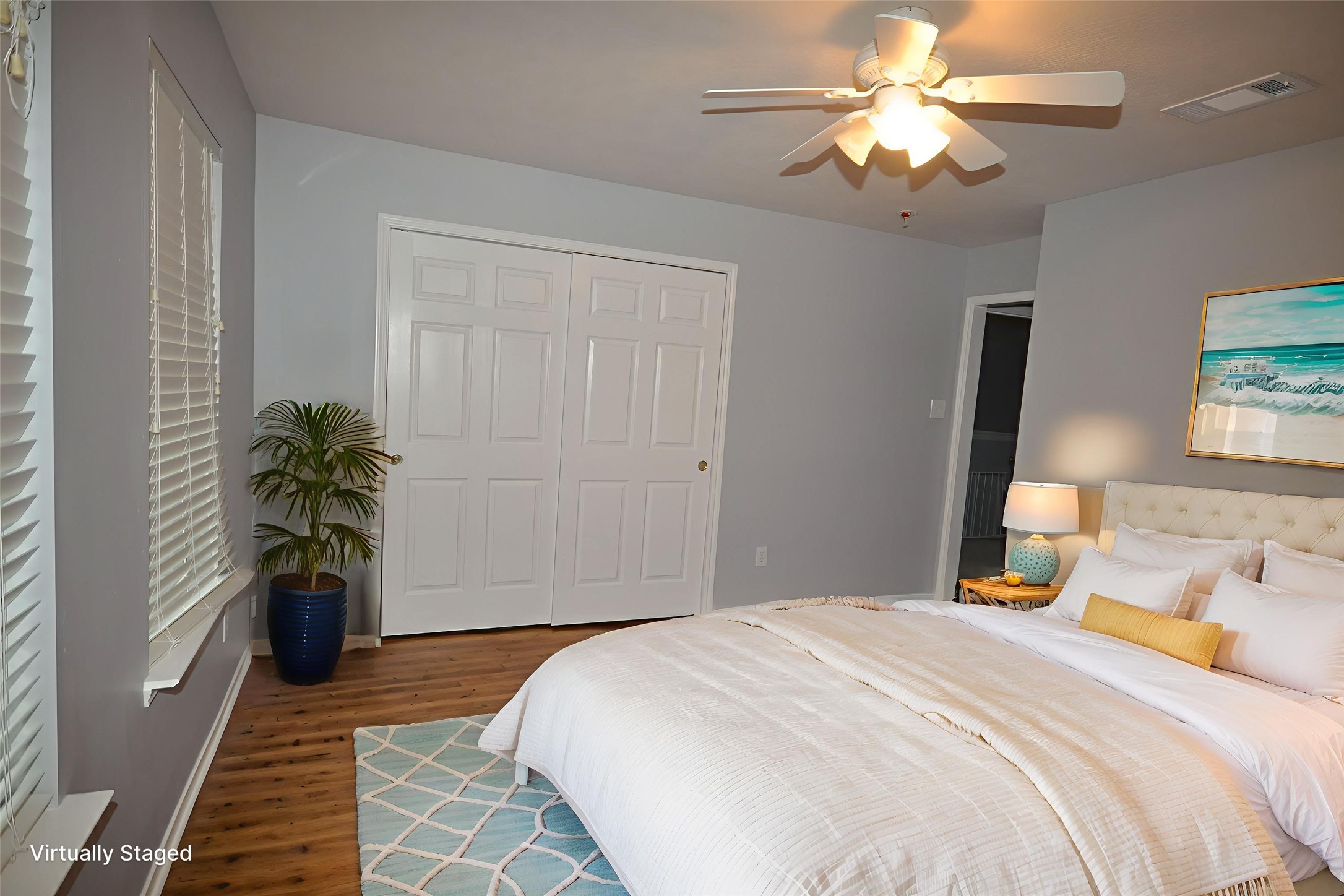 3918 Austin Lake Court Pearland, TX 77581 - Photo 19 of 32 a bedroom with a bed and a chandelier