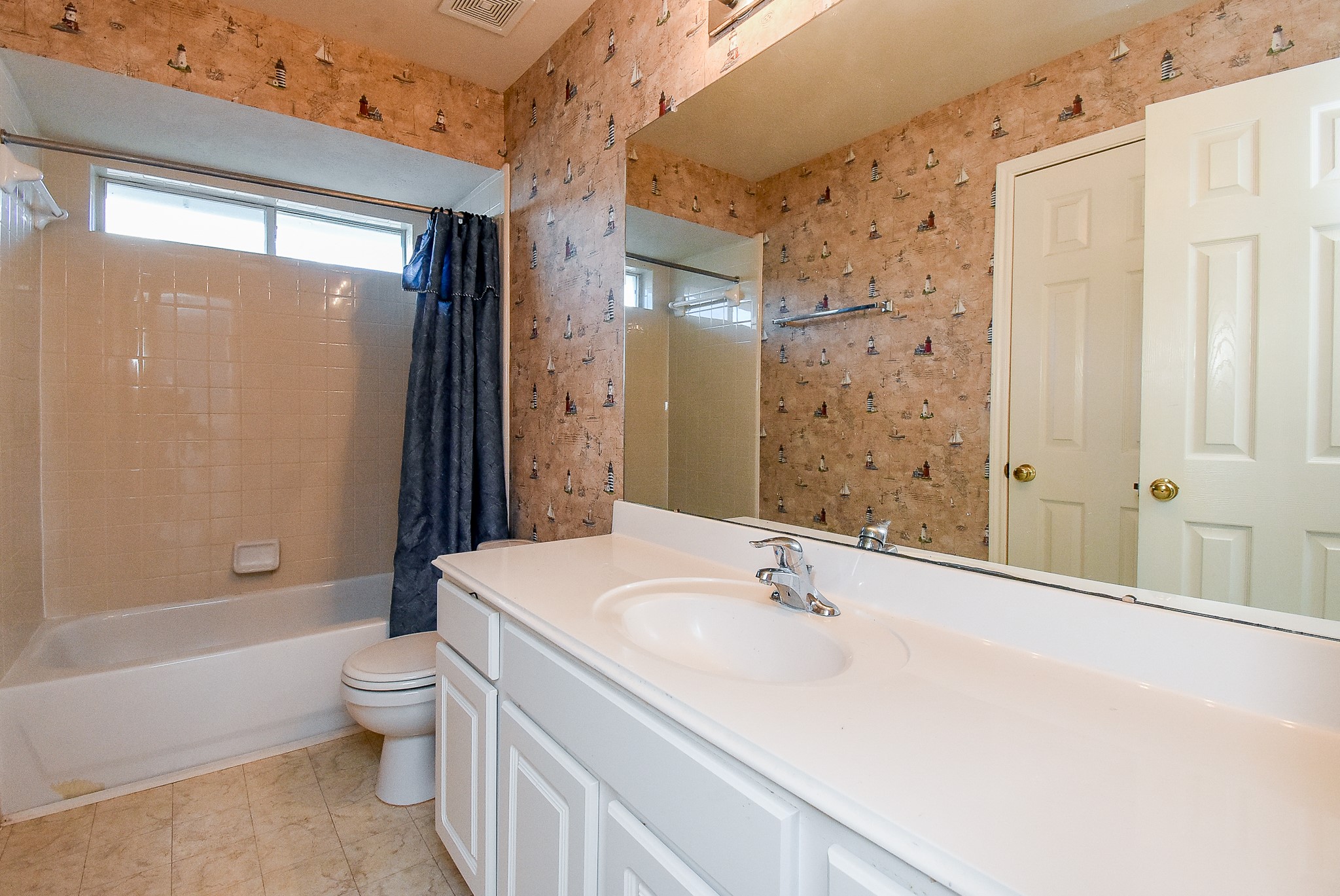 3918 Austin Lake Court Pearland, TX 77581 - Photo 23 of 32 a bathroom with a sink a toilet and shower