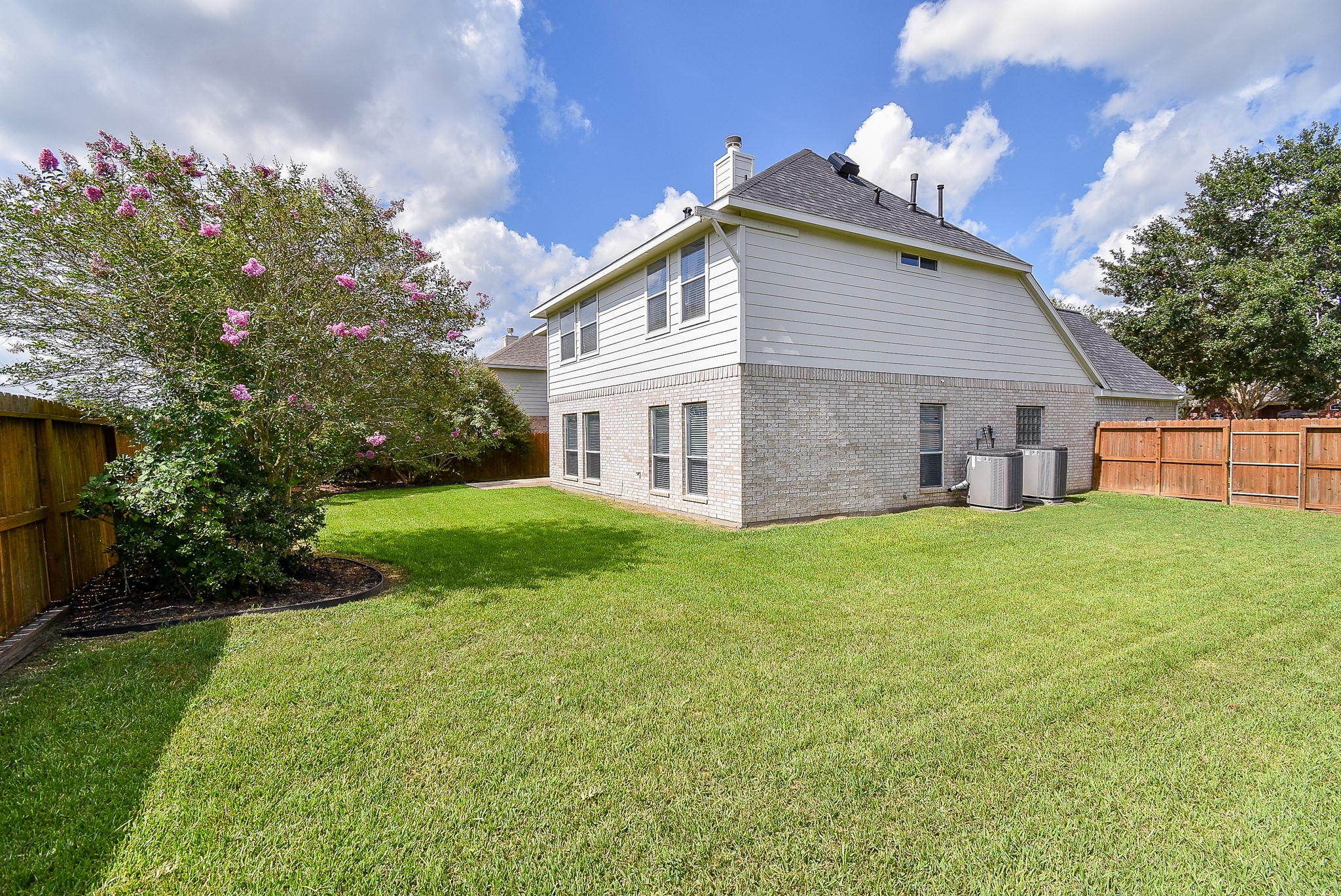 3918 Austin Lake Court Pearland, TX 77581 - Photo 28 of 32 a view of a house with a yard