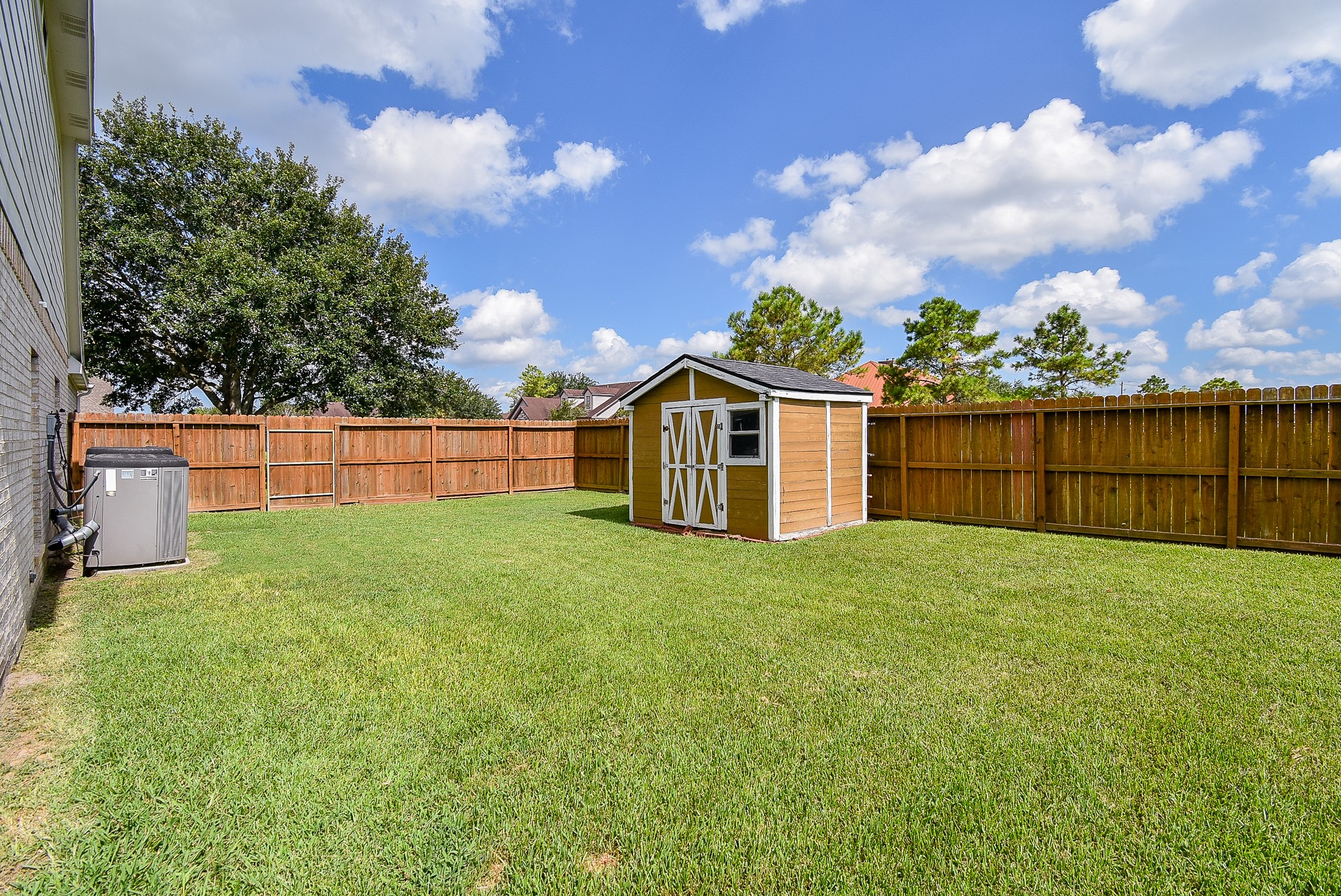 3918 Austin Lake Court Pearland, TX 77581 - Photo 29 of 32 a view of a backyard with green space