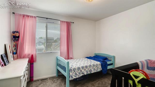5395 Rondo Way Colorado Springs, CO 80911 - Photo 17 of 28 Third Upper Level Bedroom