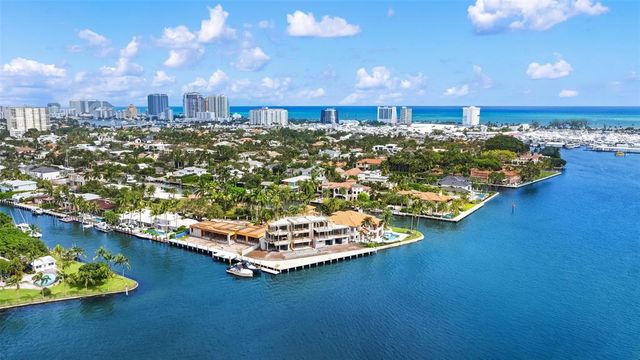 a city view with boat and palm trees
