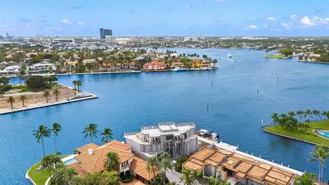 an aerial view of a house with a ocean view