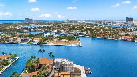 an aerial view of a house with a ocean view