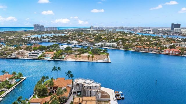 an aerial view of a house with a ocean view