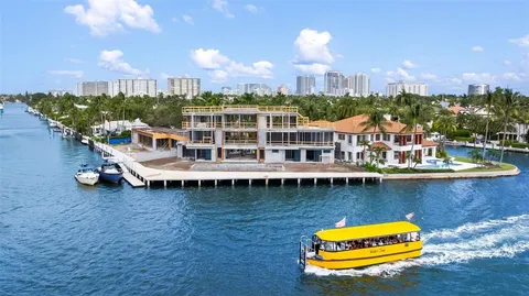 a roof deck with table and chairs and wooden floor