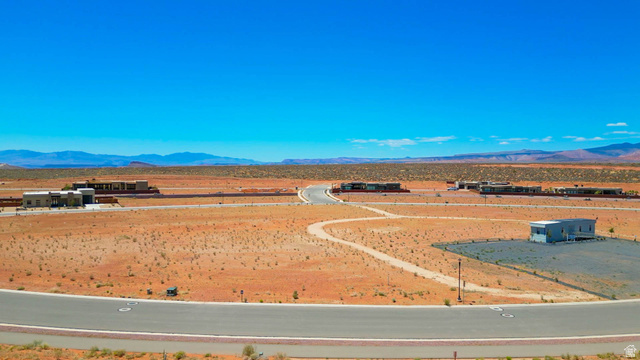 3306 South Endless Trail, Unit 33 Hurricane, UT 84737 - Photo 20 of 27 Expansive desert landscape featuring paved roadways and distant mountain ranges