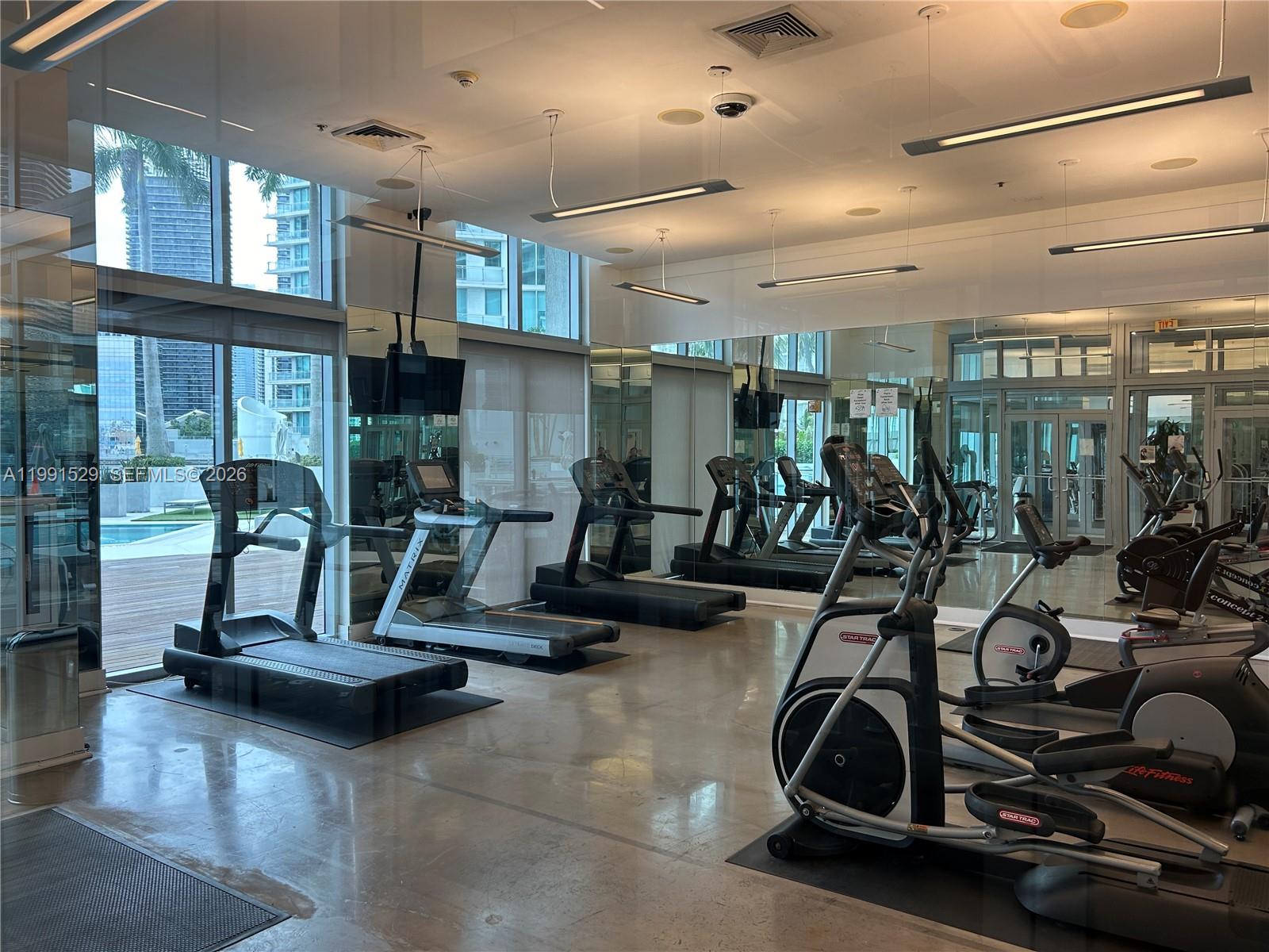 90 Southwest 3rd Street, Unit 3610 Miami, FL 33130 - Photo 36 of 38 a view of a room with gym equipment