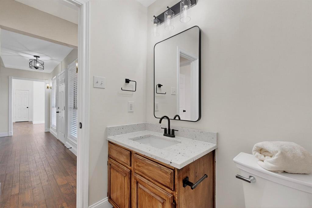 2601 Daisy Lane Rowlett, TX 75089 - Photo 16 of 36 a bathroom with a sink and a mirror