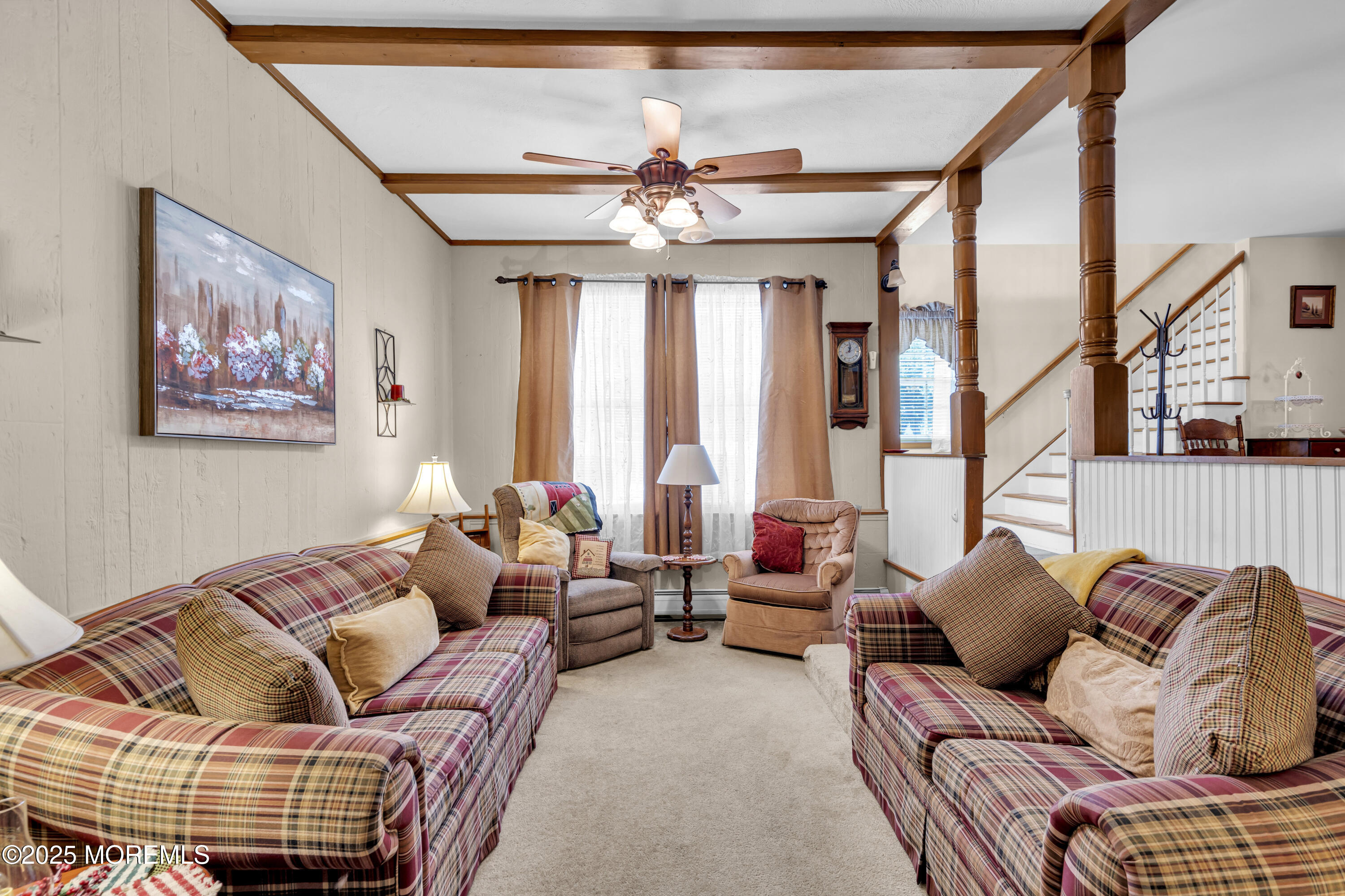 2221 Wilson Road Point Pleasant, NJ 08742 - Photo 12 of 63 a living room with furniture ceiling fan and a rug