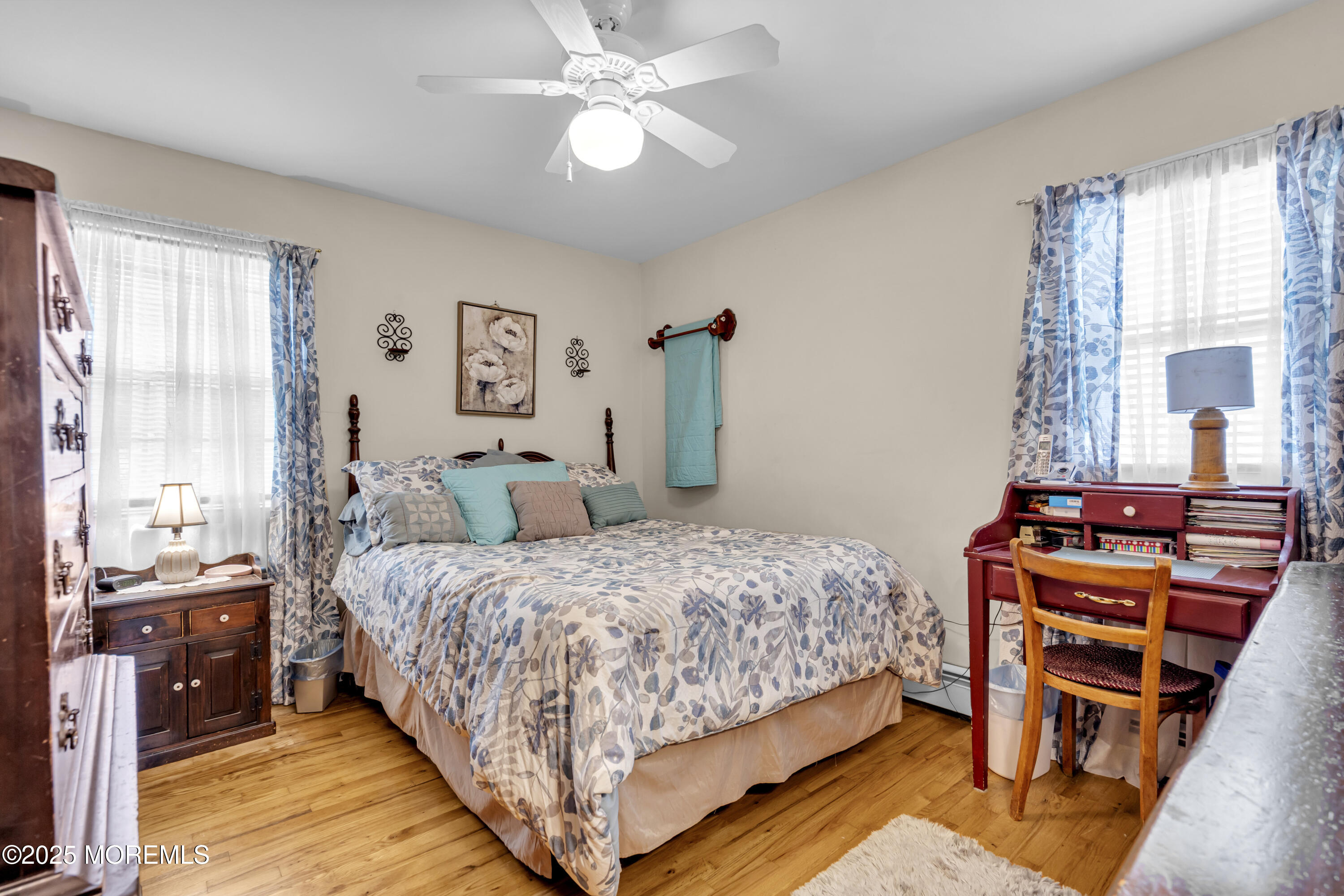 2221 Wilson Road Point Pleasant, NJ 08742 - Photo 32 of 63 a bedroom with a bed and a chandelier