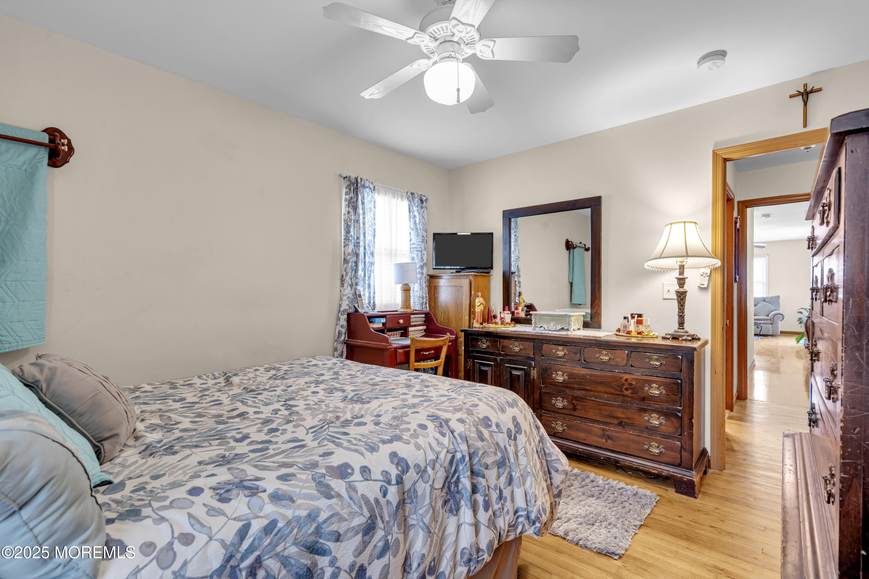 2221 Wilson Road Point Pleasant, NJ 08742 - Photo 33 of 63 a bedroom with a bed and a chandelier