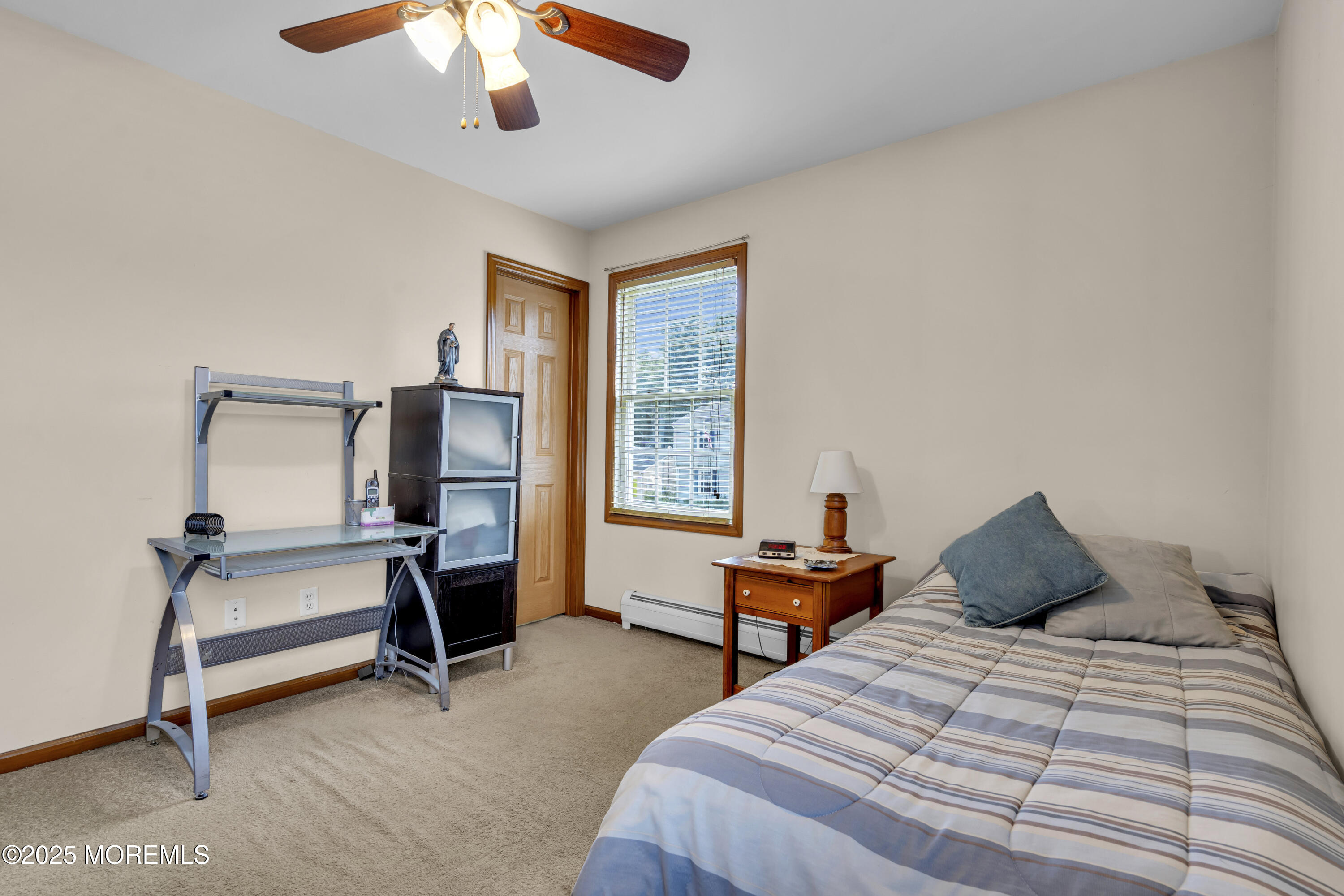 2221 Wilson Road Point Pleasant, NJ 08742 - Photo 39 of 63 a bedroom with two beds and a chandelier