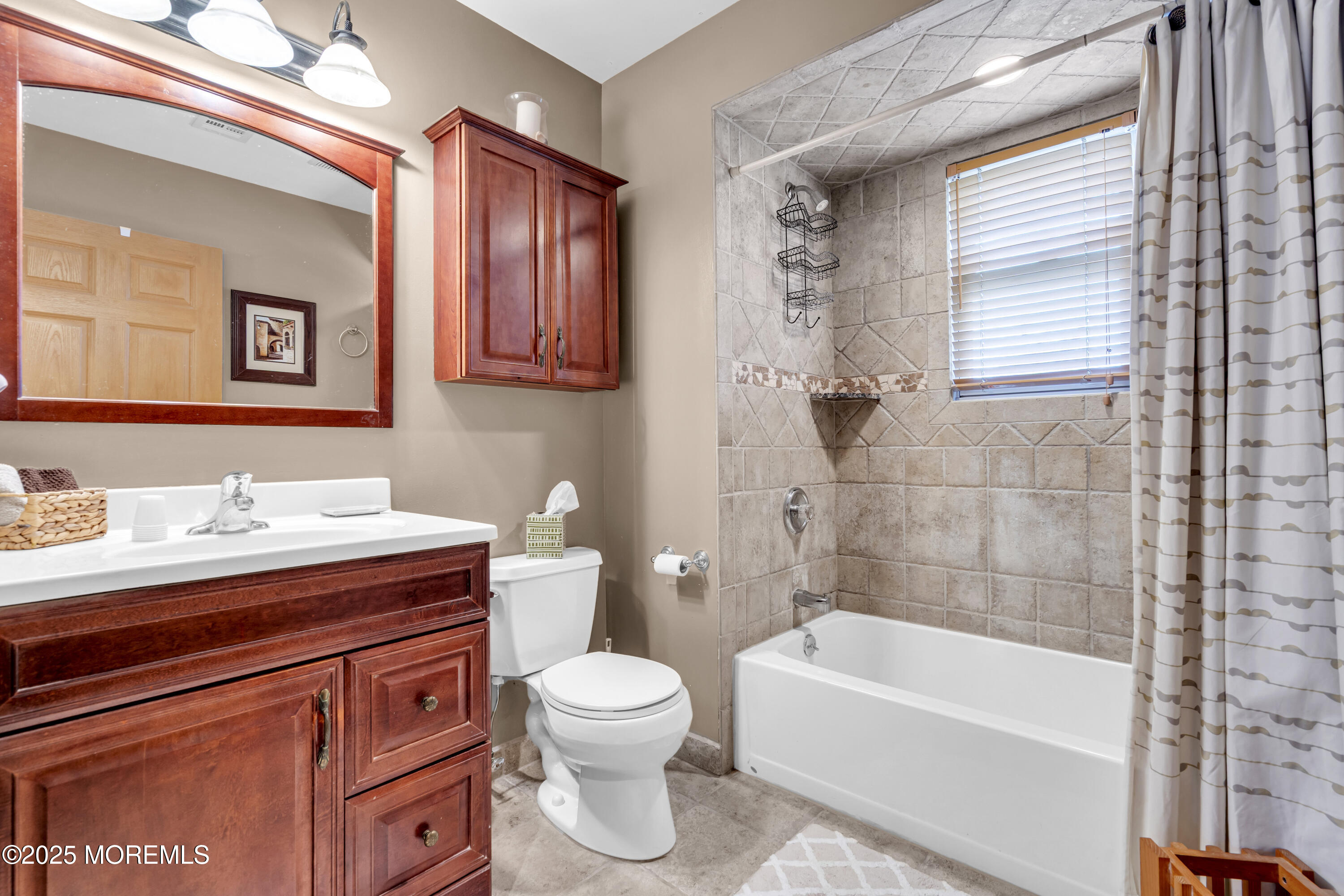 2221 Wilson Road Point Pleasant, NJ 08742 - Photo 41 of 63 a bathroom with a sink a toilet and bathtub