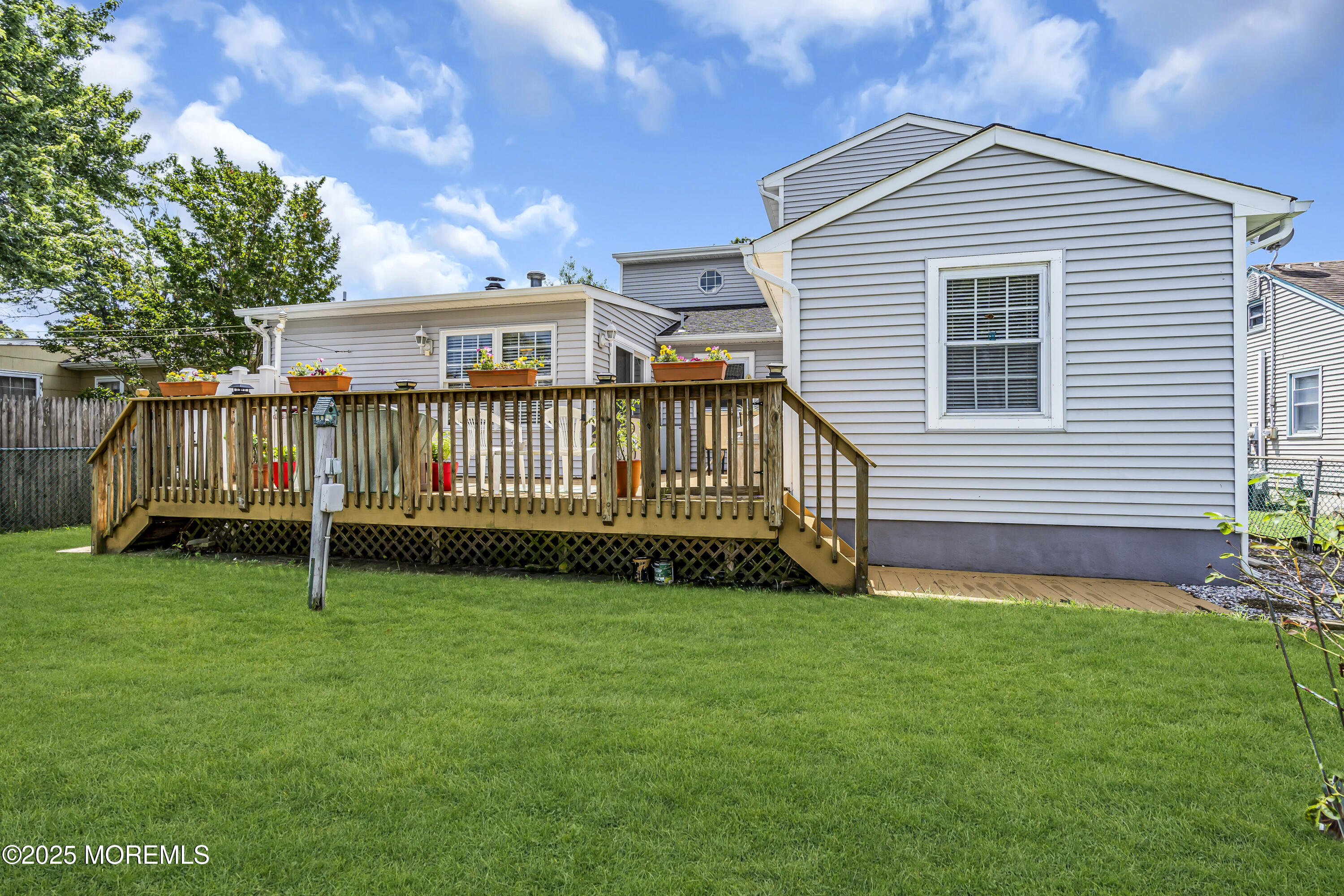 2221 Wilson Road Point Pleasant, NJ 08742 - Photo 53 of 63 a view of a house with a yard and deck