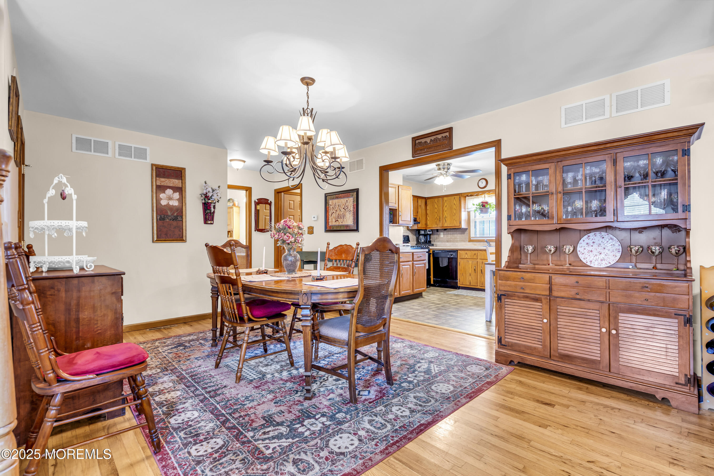 2221 Wilson Road Point Pleasant, NJ 08742 - Photo 7 of 63 a view of a dining room with furniture and chandelier