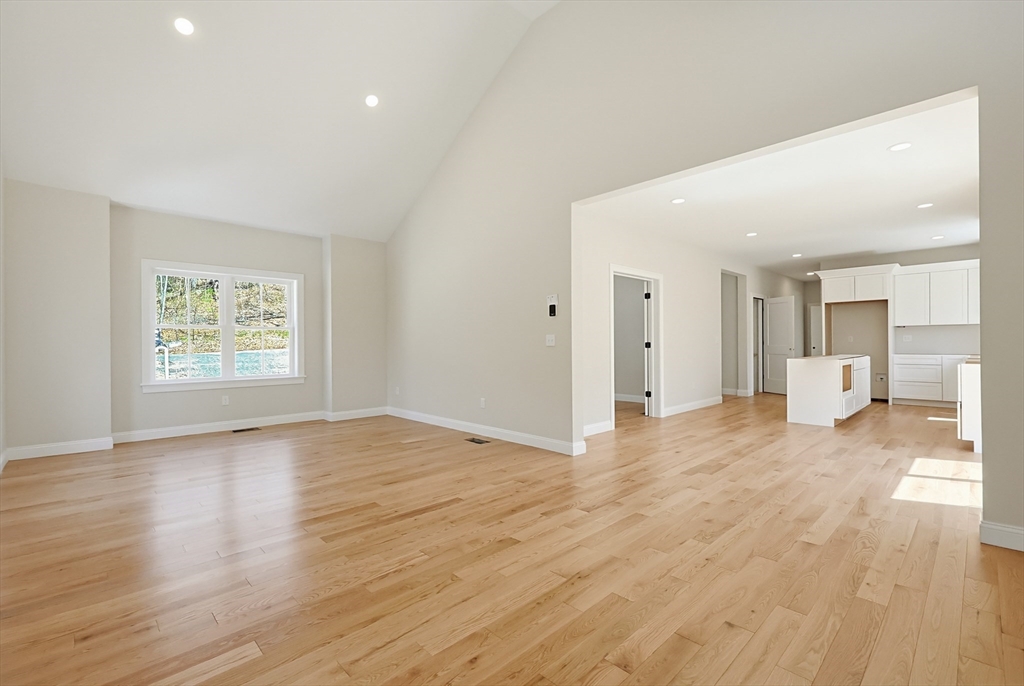 112 West Meadow Road Townsend, MA 01474 - Photo 9 of 38 a view of an empty room with wooden floor and a window