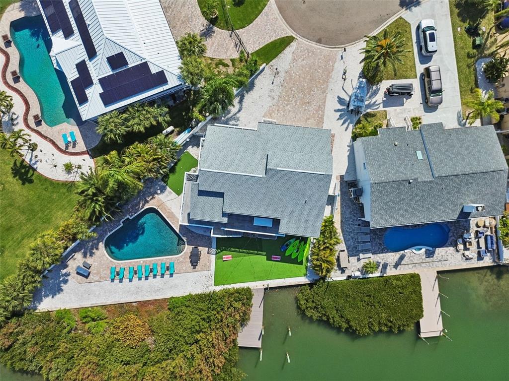 330 6th Avenue Indian Rocks Beach, FL 33785 - Photo 47 of 52 an aerial view of a house with a garden and swimming pool