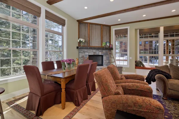 a dining room with furniture and wooden floor