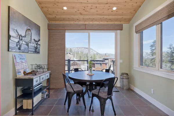 a kitchen with kitchen island granite countertop a sink and a counter top space