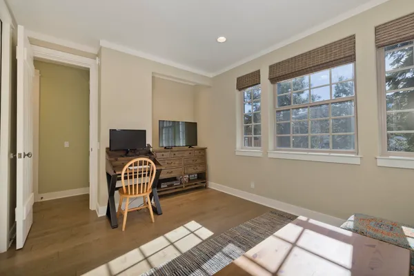 a bedroom with furniture and a window