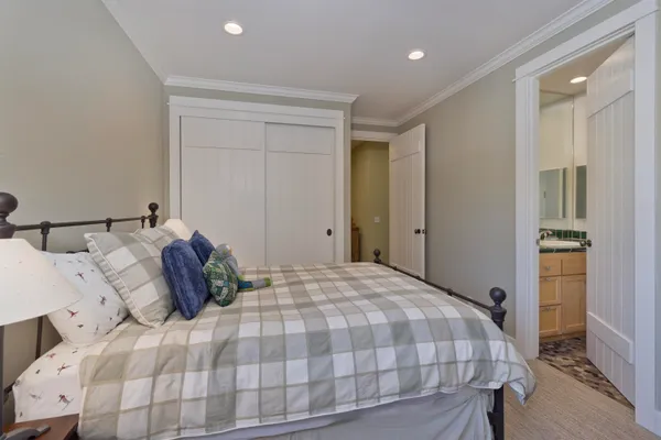 a bedroom with a bed and window