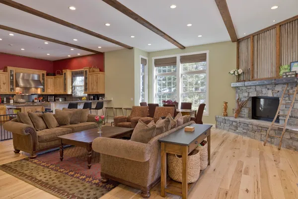 a living room with fireplace furniture and a fireplace