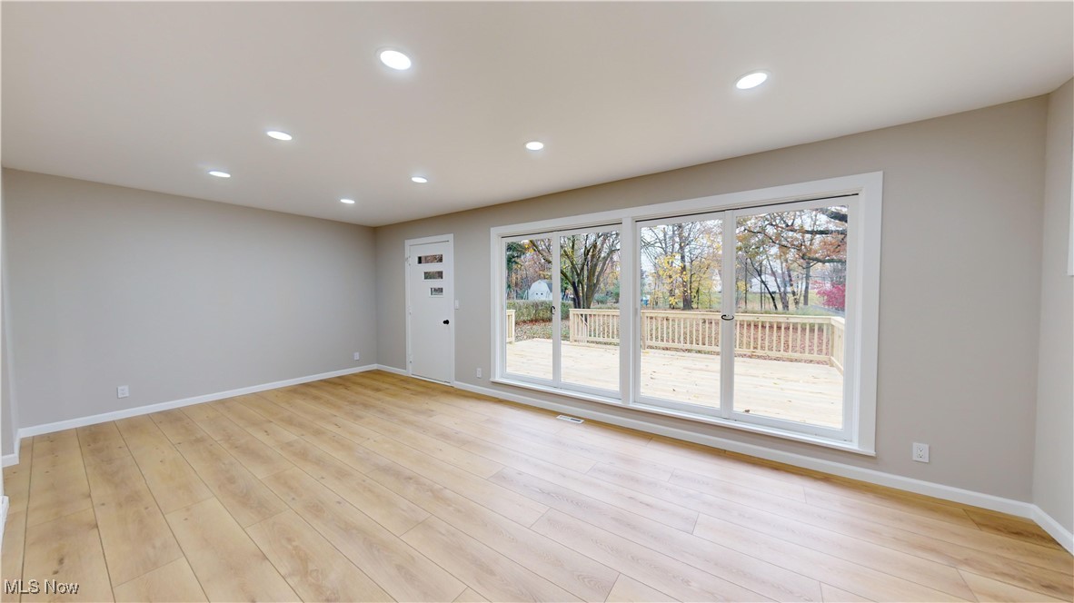 5252 Spencer Road Cleveland, OH 44124 - Photo 14 of 33 Empty room with light hardwood / wood-style floors