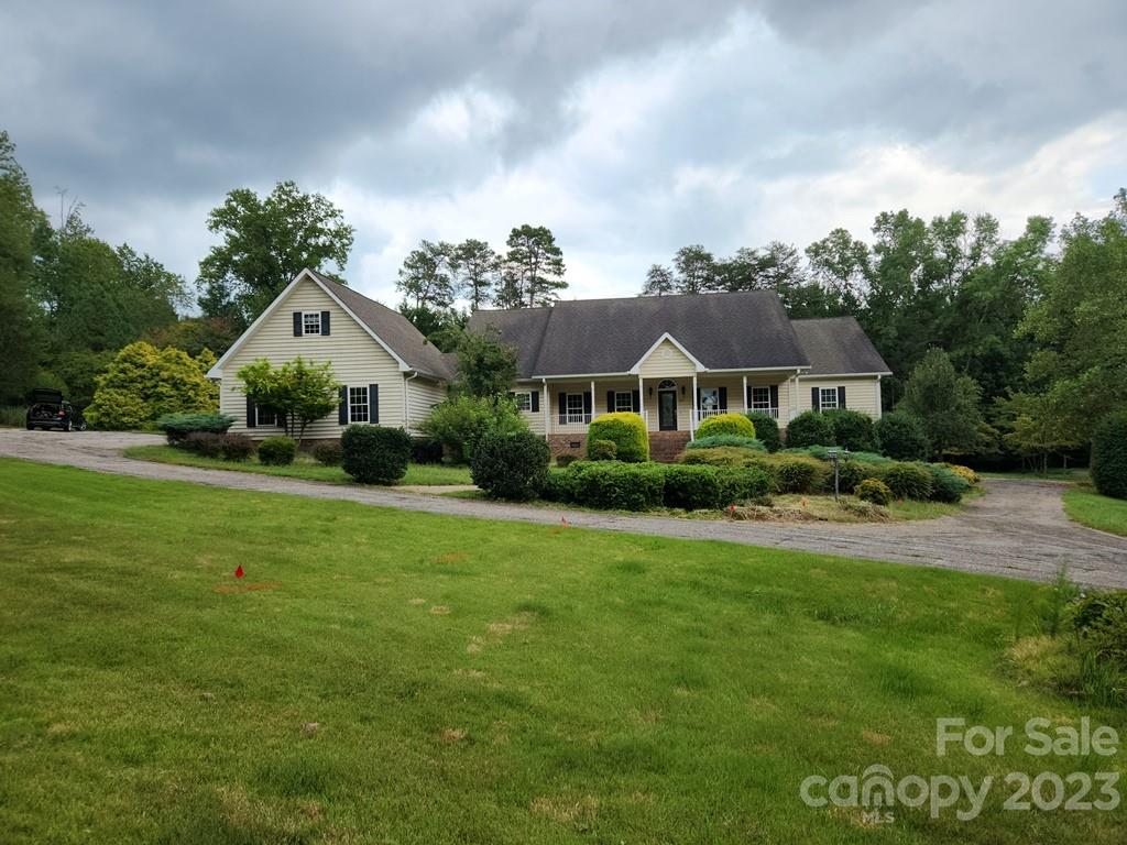 360 Hooper Creek Road Tryon, NC 28782 - Photo 1 of 38 a front view of a house with garden