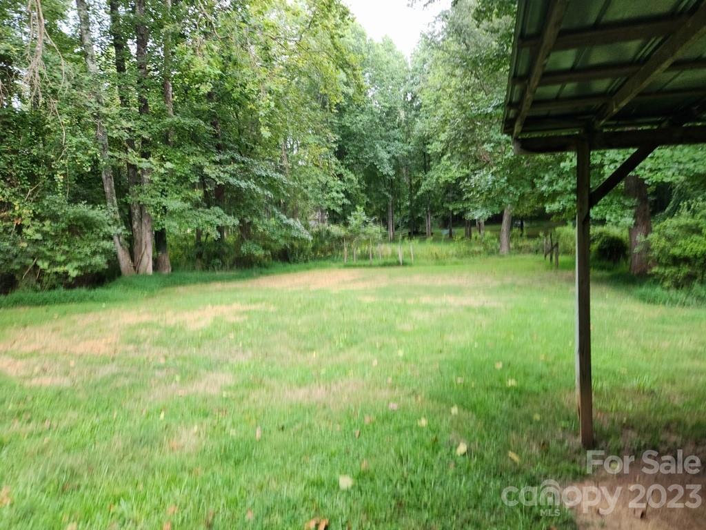 360 Hooper Creek Road Tryon, NC 28782 - Photo 11 of 38 a view of a field with a tree