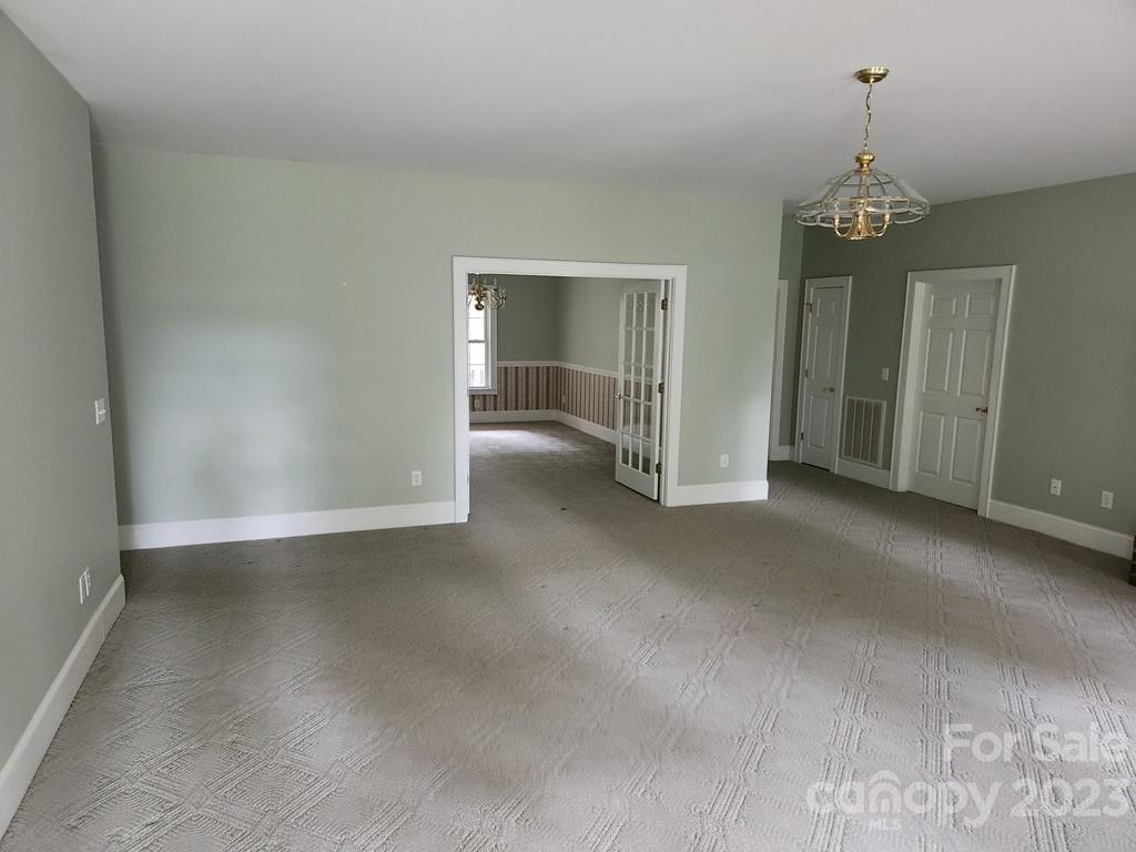 360 Hooper Creek Road Tryon, NC 28782 - Photo 17 of 38 an empty room with windows and closet