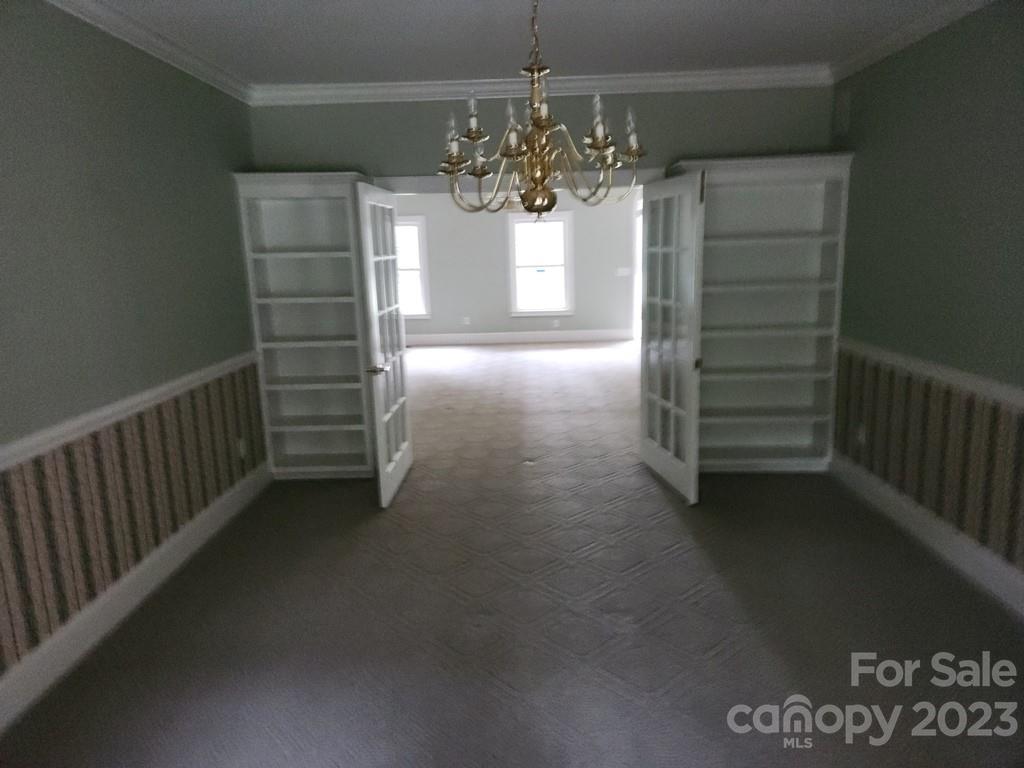 360 Hooper Creek Road Tryon, NC 28782 - Photo 19 of 38 a view of a chandelier in big room and chandelier
